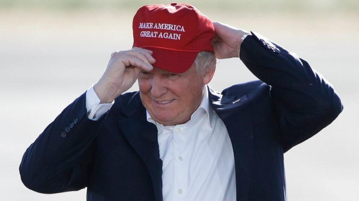 Donald Trump with a Make America Great Again hat.jpeg