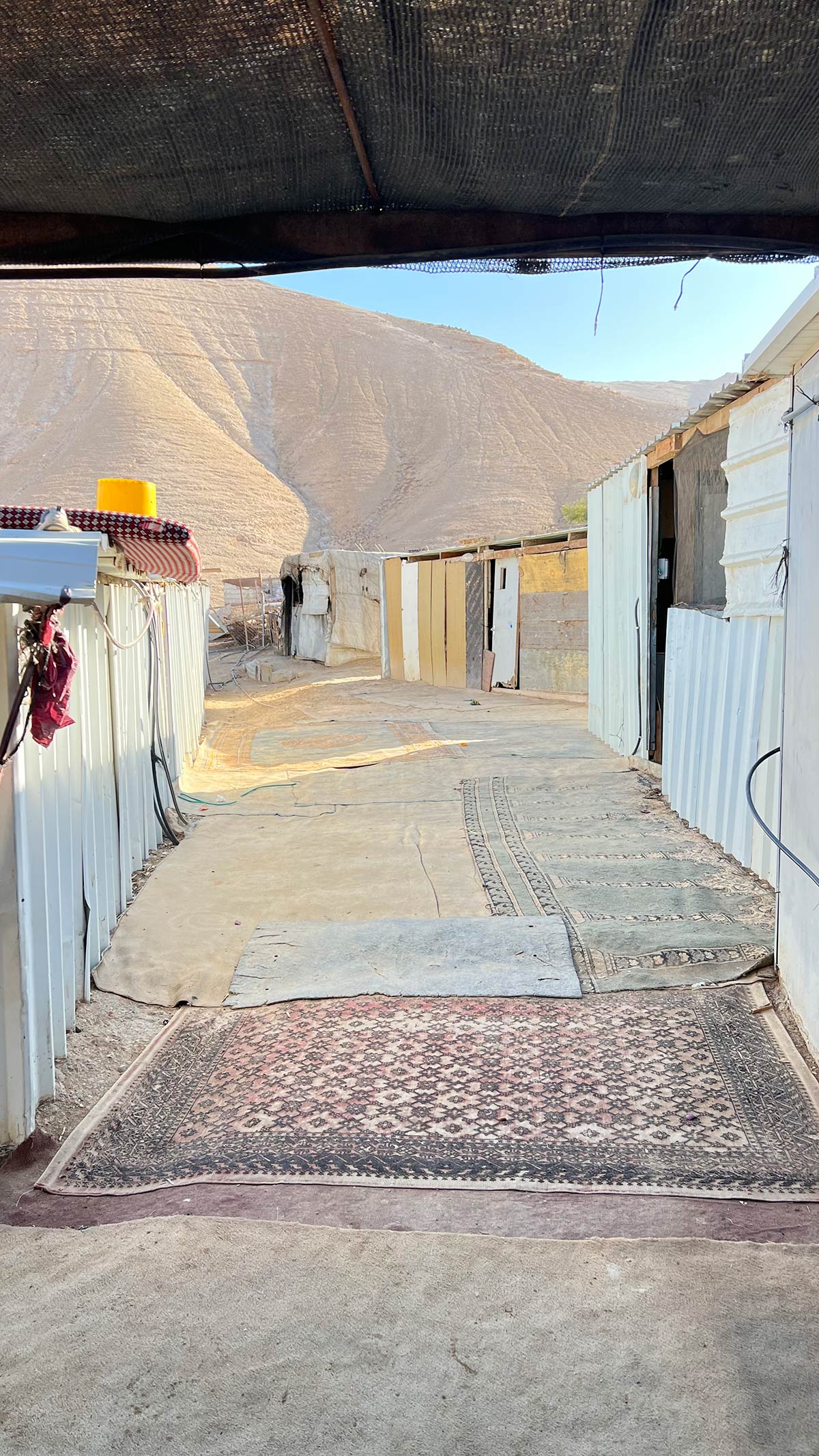 Houses in Khan al Ahmar where Lara visits the woman she purchases wool from.