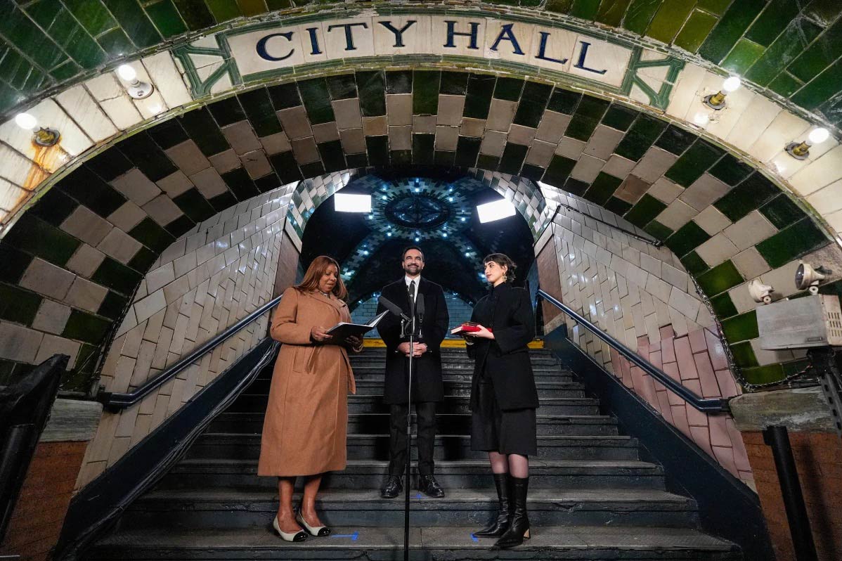 Zohran Mamdani stands in the decommissioned City Hall subway station at his mayoral inauguration